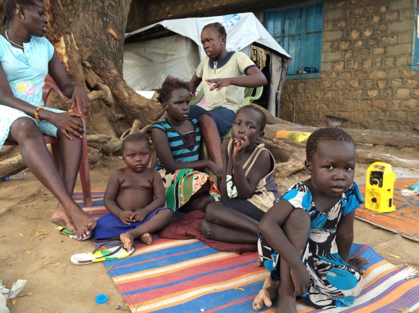 A Murle family from Pibor, an administrative area located within Jonglei state of South Sudan, listens to My Mahad